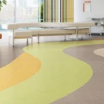 Vinílico Magma Acoustic GRAPHITE, CANARY, KIWI 3mm Sala Recepción